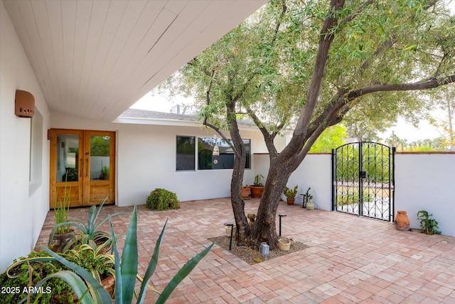 view of patio featuring french doors