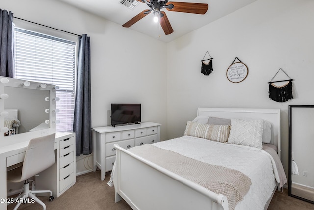 carpeted bedroom with ceiling fan