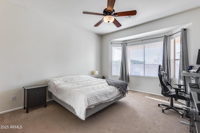 bedroom with ceiling fan and carpet floors