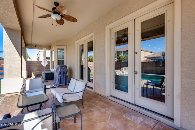 view of patio featuring ceiling fan and french doors