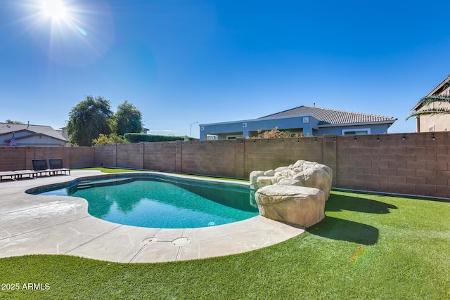 view of swimming pool with a yard and a patio