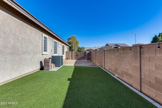 view of yard featuring central AC