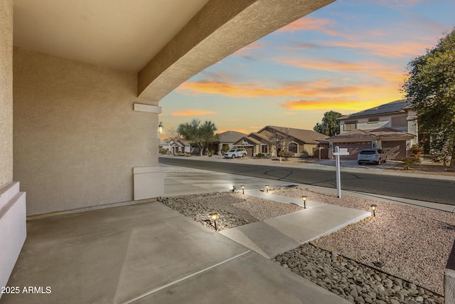 patio terrace at dusk with a garage