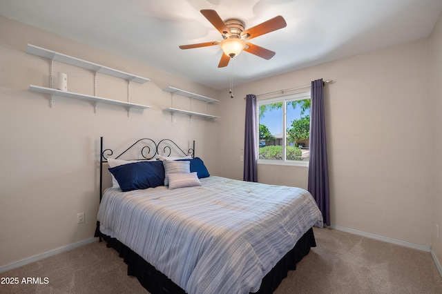 carpeted bedroom with baseboards and ceiling fan