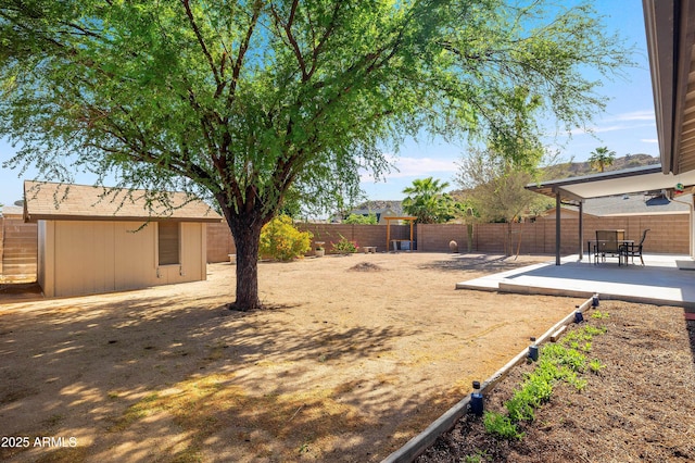 fenced backyard with a patio