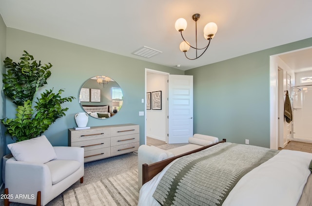 bedroom with a notable chandelier, visible vents, and baseboards