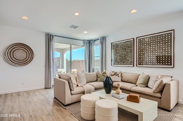 living room featuring visible vents, recessed lighting, light wood-type flooring, and baseboards