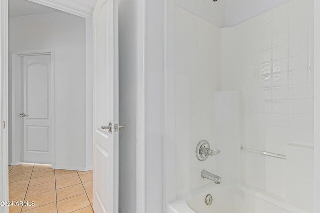 bathroom featuring shower / bath combination and tile patterned floors