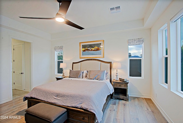 bedroom with ceiling fan and light hardwood / wood-style flooring