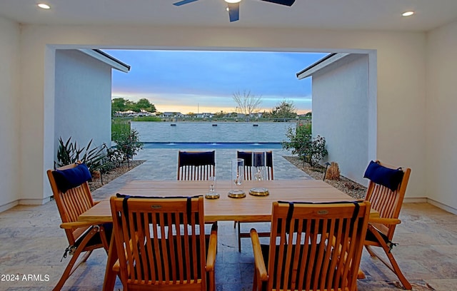 tiled dining area featuring ceiling fan