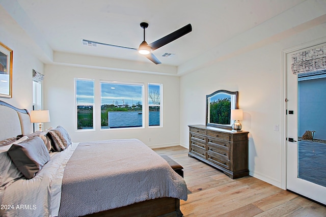 bedroom with ceiling fan and light hardwood / wood-style flooring