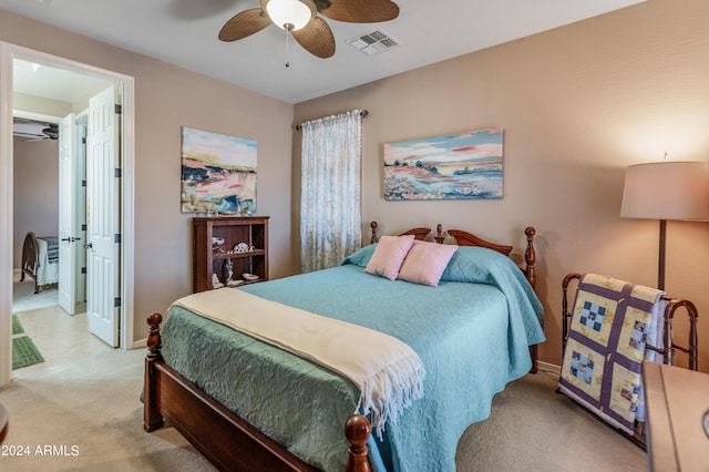 bedroom featuring ceiling fan and light colored carpet