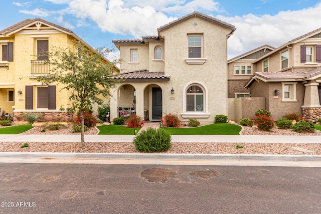 view of front of property with stucco siding and a tiled roof