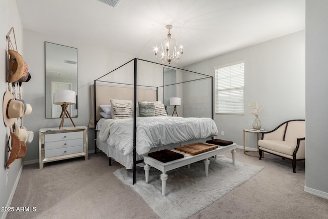 bedroom featuring baseboards, carpet floors, and a chandelier