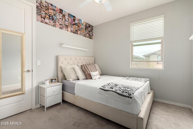 bedroom featuring baseboards, carpet, and a ceiling fan