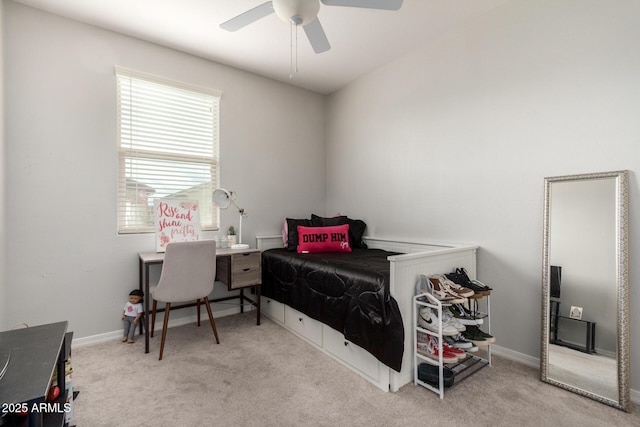 carpeted bedroom with baseboards and ceiling fan