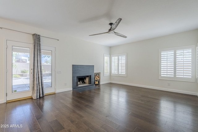 1311 N Congress Dr, Chandler, AZ 85226 - unfurnished living room featuring ceiling fan, dark wood-style floors, a fireplace, and baseboards