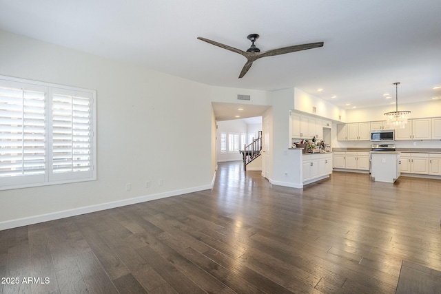 1311 N Congress Dr, Chandler, AZ 85226 - unfurnished living room featuring a ceiling fan, dark wood-style floors, stairway, baseboards, and recessed lighting