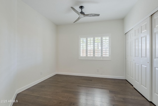 1311 N Congress Dr, Chandler, AZ 85226 - unfurnished bedroom featuring dark wood-style flooring, baseboards, a closet, and a ceiling fan
