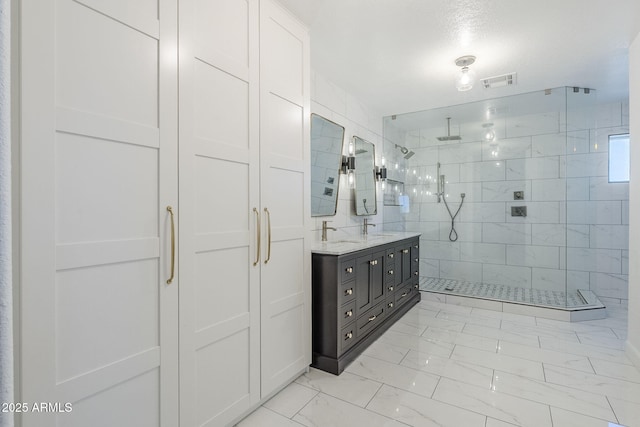 1311 N Congress Dr, Chandler, AZ 85226 - bathroom with marble look tiles, a tile shower, and double vanity