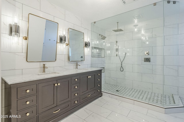 1311 N Congress Dr, Chandler, AZ 85226 - bathroom featuring marble finish flooring, tiled shower, and double vanity