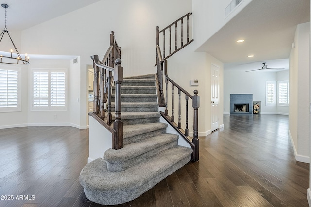 1311 N Congress Dr, Chandler, AZ 85226 - stairs with a chandelier, wood finished floors, a ceiling fan, baseboards, and recessed lighting