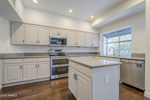 1311 N Congress Dr, Chandler, AZ 85226 - kitchen featuring stainless steel appliances, a sink, white cabinets, dark wood-type flooring, and recessed lighting