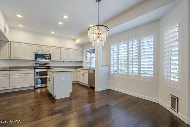 1311 N Congress Dr, Chandler, AZ 85226 - kitchen featuring stainless steel appliances, a sink, a chandelier, white cabinets, and recessed lighting
