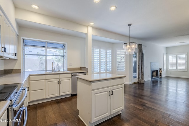 1311 N Congress Dr, Chandler, AZ 85226 - kitchen featuring a sink, stainless steel appliances, a chandelier, white cabinets, and recessed lighting
