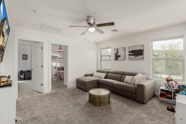 2540 N Stone Hill Rd, Buckeye, AZ 85396 - living area featuring visible vents, ceiling fan, carpet floors, and a wealth of natural light