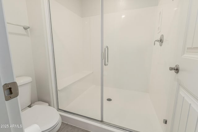 2540 N Stone Hill Rd, Buckeye, AZ 85396 - bathroom with toilet and a shower stall