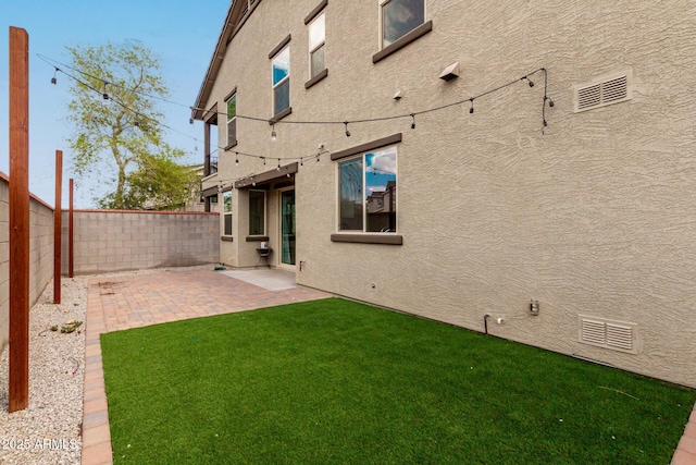 2540 N Stone Hill Rd, Buckeye, AZ 85396 - view of yard featuring a fenced backyard, a patio area, and visible vents