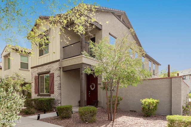 2540 N Stone Hill Rd, Buckeye, AZ 85396 - view of front of home featuring brick siding, fence, and a balcony