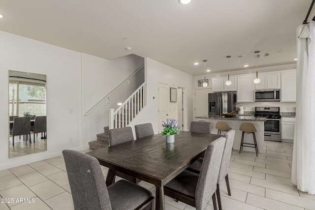 2540 N Stone Hill Rd, Buckeye, AZ 85396 - dining space with recessed lighting, light tile patterned flooring, and stairway