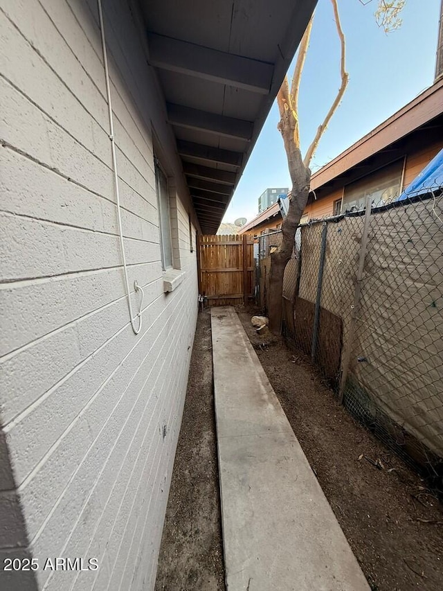 view of property exterior with fence