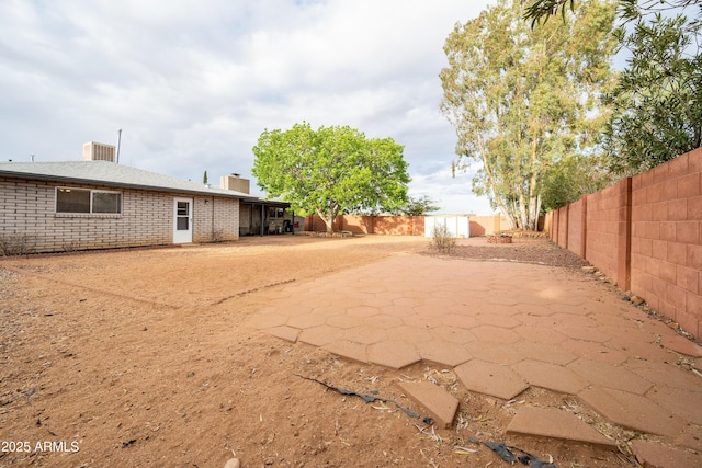view of yard featuring a fenced backyard and a patio area