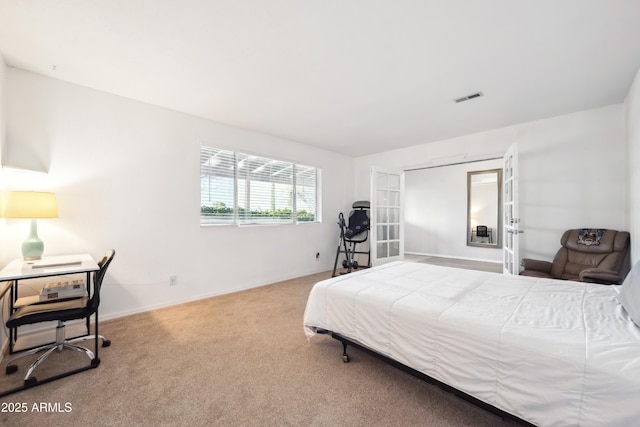 bedroom featuring carpet flooring, visible vents, french doors, and baseboards