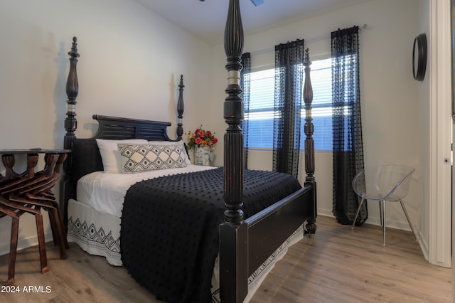 bedroom with wood-type flooring