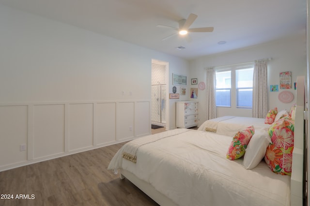 bedroom featuring hardwood / wood-style flooring and ceiling fan