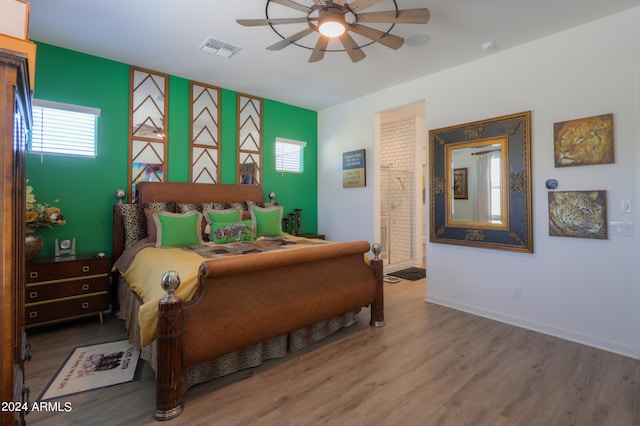 bedroom with ceiling fan and hardwood / wood-style flooring