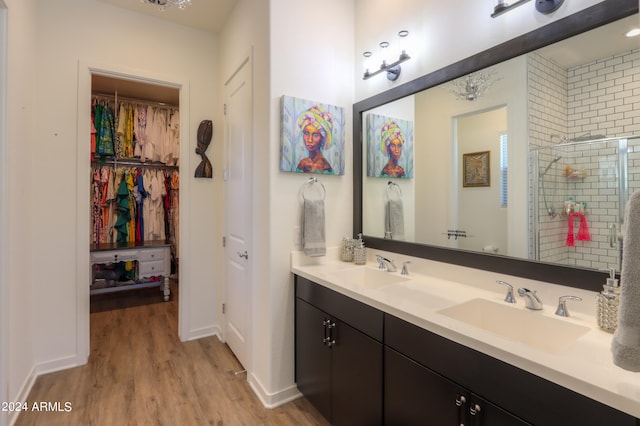 bathroom featuring vanity, hardwood / wood-style flooring, and an enclosed shower