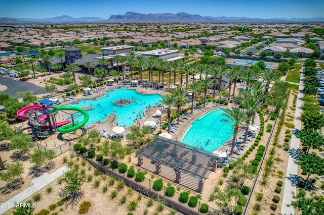 birds eye view of property featuring a mountain view