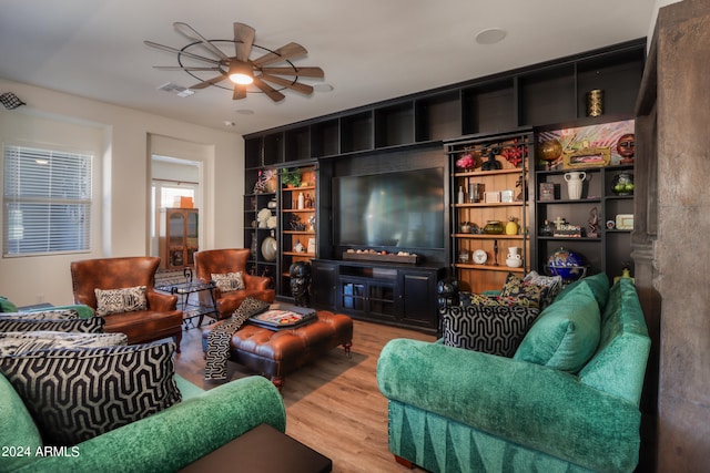 living room with ceiling fan and hardwood / wood-style flooring