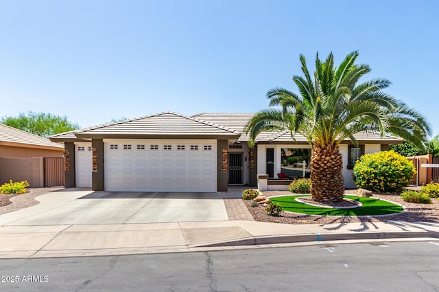 2910 S Olivewood, Mesa, AZ 85212 - ranch-style home featuring an attached garage, concrete driveway, stucco siding, and a tiled roof