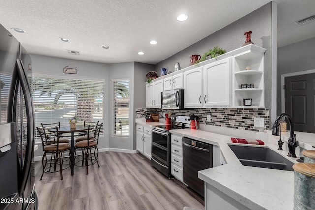2910 S Olivewood, Mesa, AZ 85212 - kitchen featuring black appliances, open shelves, a sink, recessed lighting, and backsplash