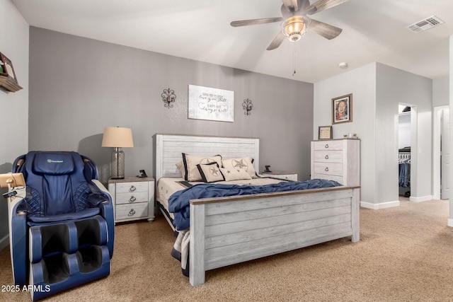 2910 S Olivewood, Mesa, AZ 85212 - bedroom featuring carpet floors, a ceiling fan, a walk in closet, and baseboards