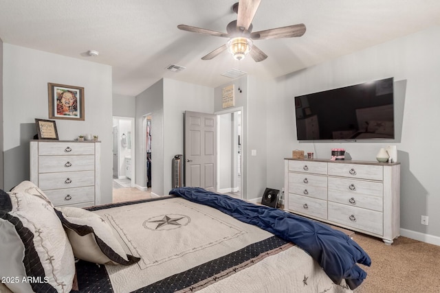 2910 S Olivewood, Mesa, AZ 85212 - bedroom with light colored carpet, baseboards, ceiling fan, and connected bathroom