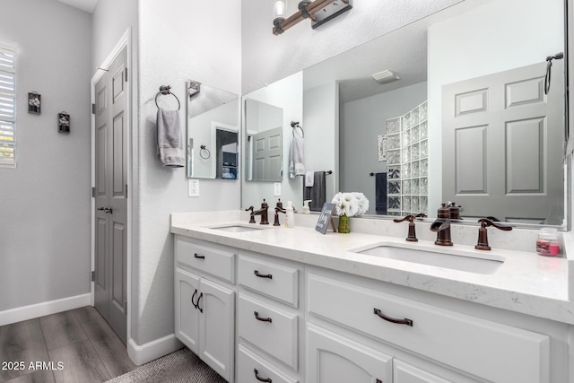 2910 S Olivewood, Mesa, AZ 85212 - full bathroom featuring baseboards, wood finished floors, double vanity, and a shower