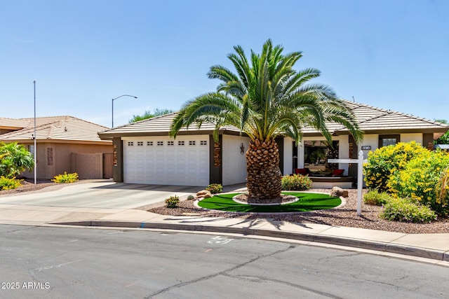2910 S Olivewood, Mesa, AZ 85212 - obstructed view of property with a garage, concrete driveway, and stucco siding