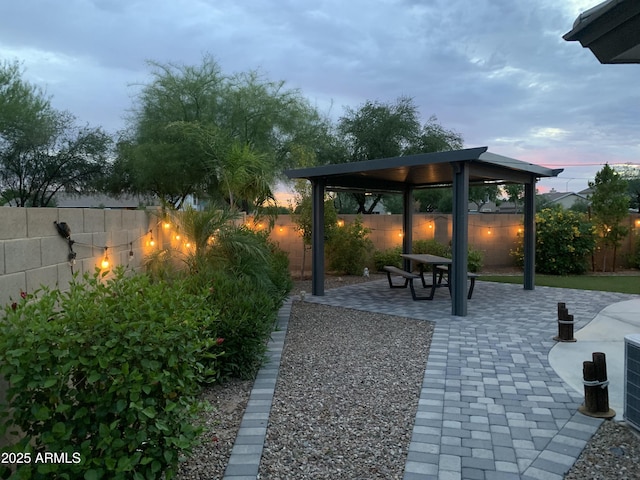 2910 S Olivewood, Mesa, AZ 85212 - patio terrace at dusk with a gazebo and a fenced backyard